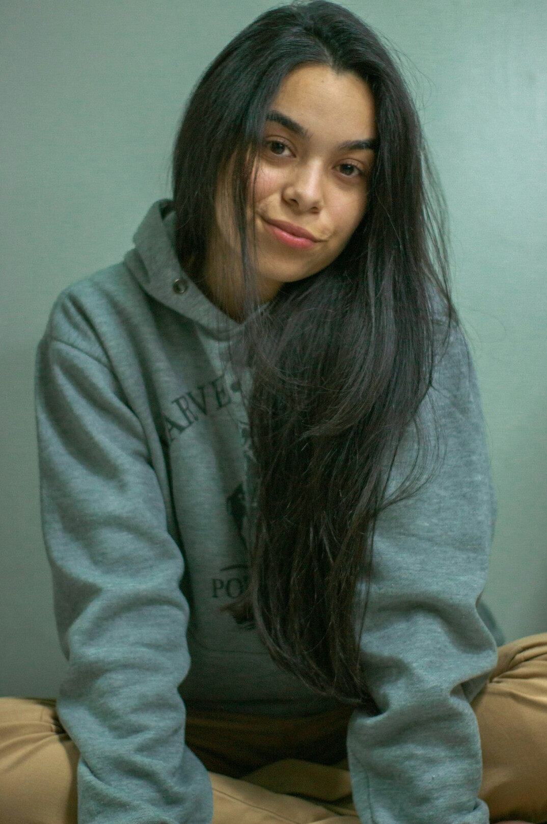 Portrait of a woman with long dark hair smiling